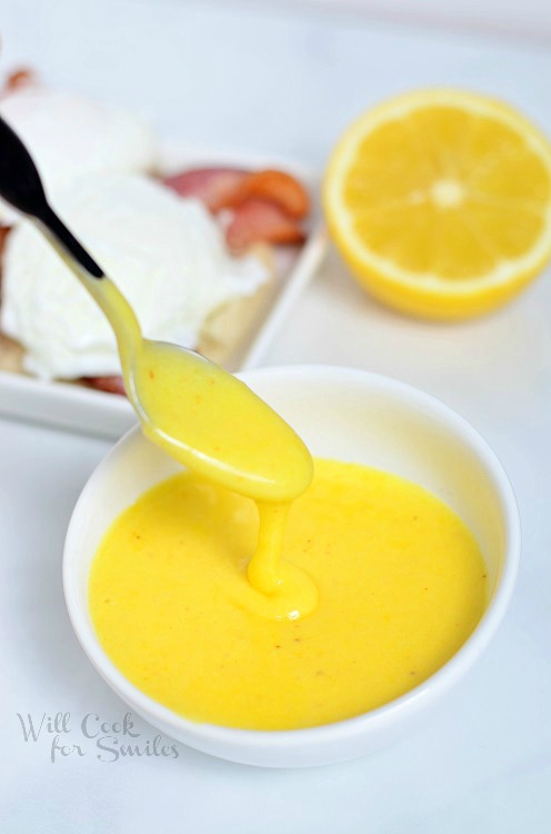 Hollandaise Sauce in a bowl with a spoon 