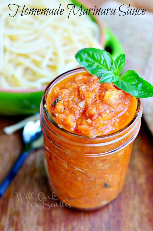Homemade Marinara Sauce in a jar with some basil 