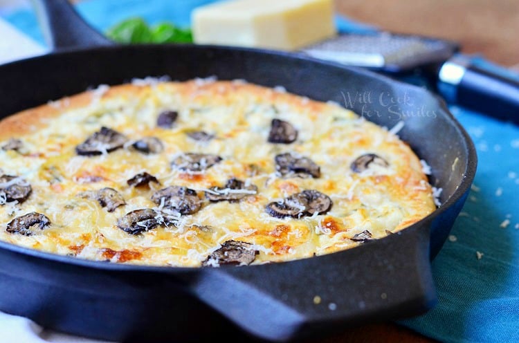 Asiago Mushroom & Onion White Pizza in a cast iron skillet 