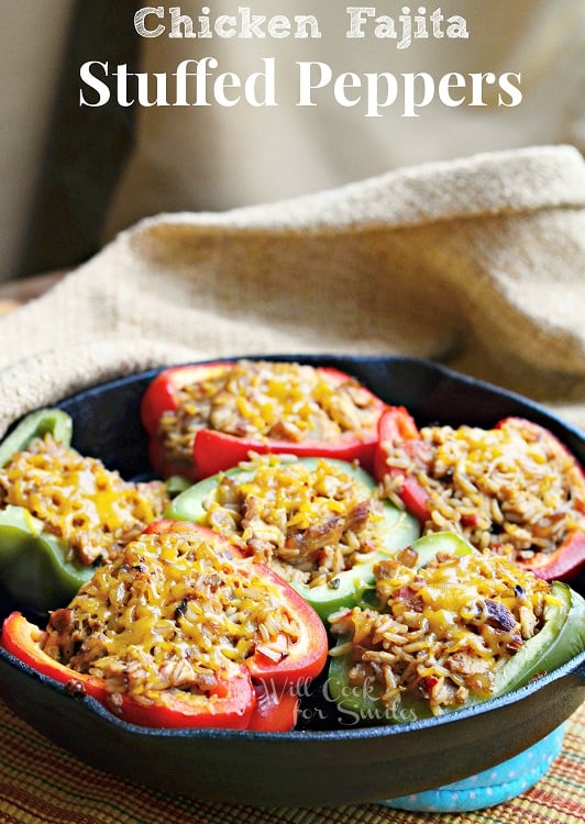 Chicken Fajitas Stuffed Peppers  in a cast iron skillet with a tan napkin 