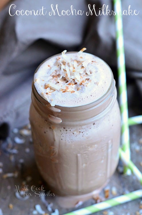 Coconut Mocha Milkshake on a table with green straws 