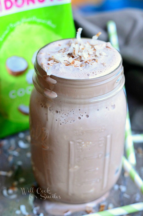 Coconut Mocha Milkshake on a table with green straws 