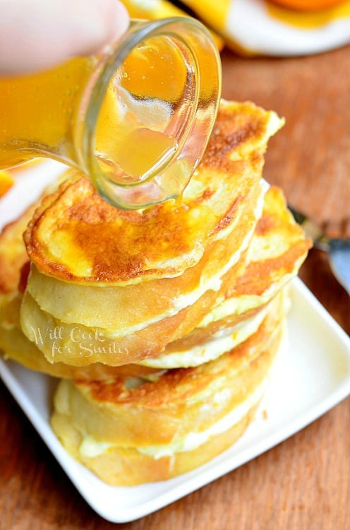 pouring syrup over Orange Creamsicle French Toast