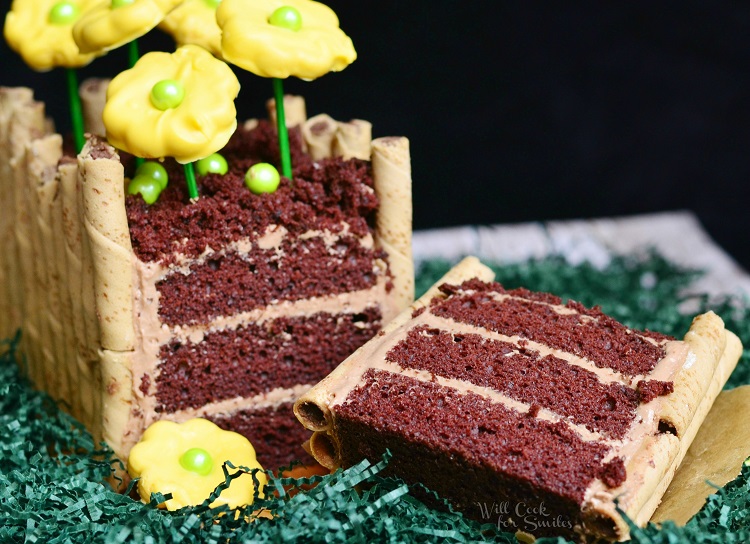 Spring Flower Bed Cake with a slice out of it 