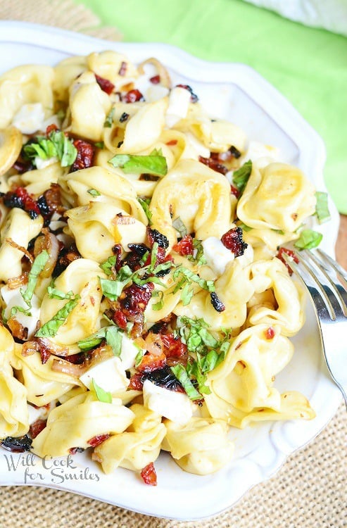 Caprese Tortellini Bowl with a fork to the left 