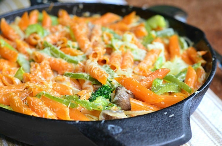 horizonal photo of pasta Primavera in a cast iron skillet 