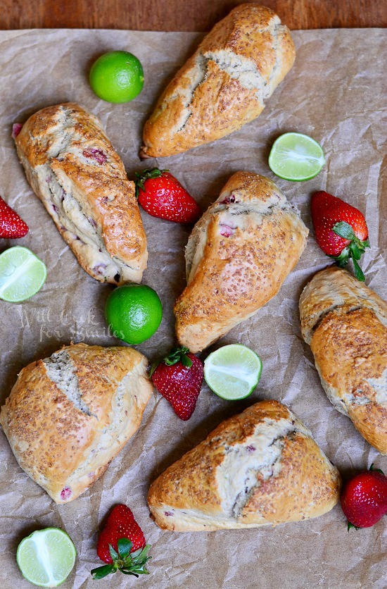 above photo of Strawberry Key Lime Scones on butcher paper with strawberry and limes 