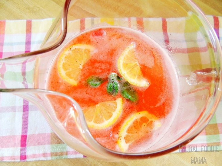 strawberry basil lemonade in a pitcher 