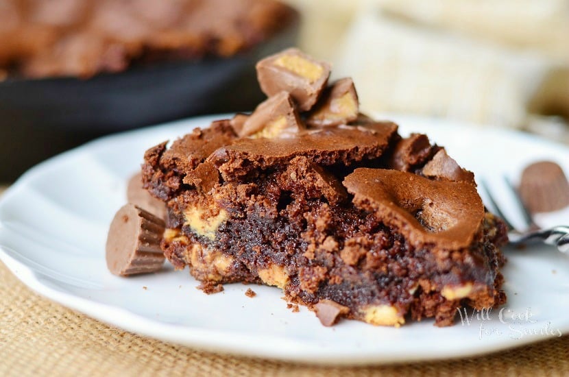 Peanut Butter Cup Brownies on a white plate with mini reese cups 