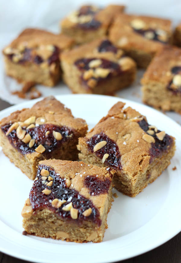 3 salted peanut butter and jelly blondies on a white plate 