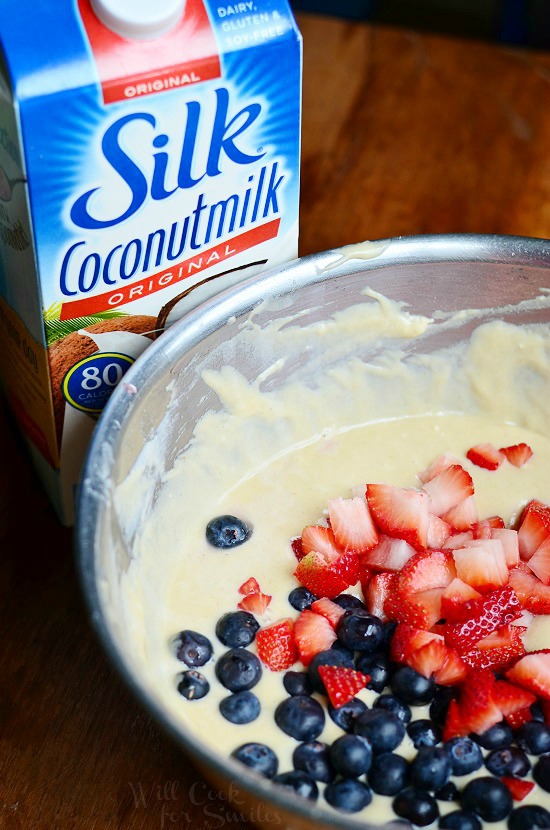 batter for berry bread with blue berries and strawberries in it 