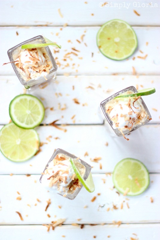 top view of dr pepper floats with ice cream and a lime with sliced lime on a table top 