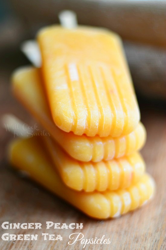 Ginger Peach Green Tea Popsicles on a wood board 