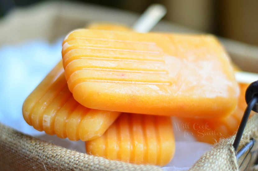 Ginger Peach Green Tea Popsicles on a wood table 