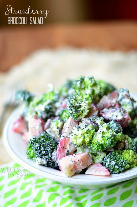 Strawberry Broccoli Salad in a white bowl with a green and white placemat