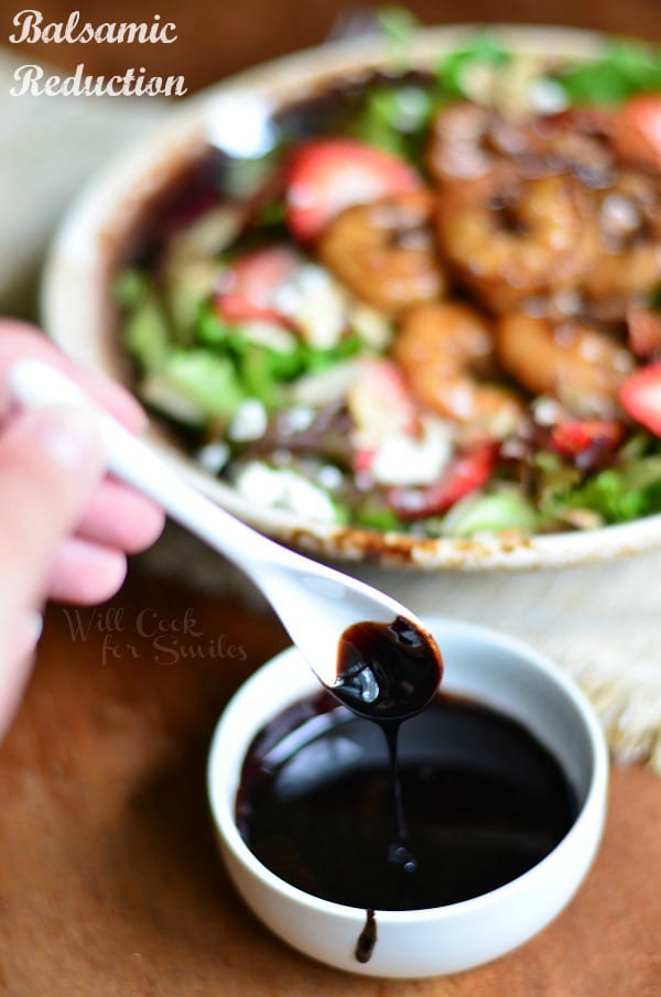 Balsamic Reduction for Balsamic Shrimp Salad in a small bowl with the salad in the background