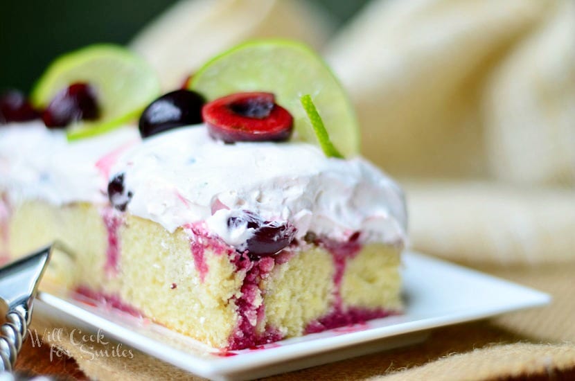 Cherry Limeade Poke Cake on a plate 