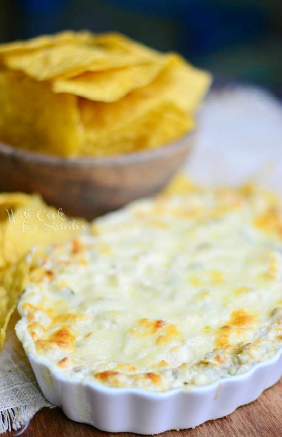 Chicken Enchilada Verde Dip in a white casserole dish 
