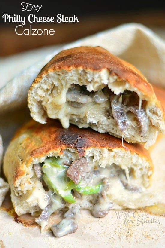 Easy Philly Cheese Steak Calzone cut in half on a tan napkin 