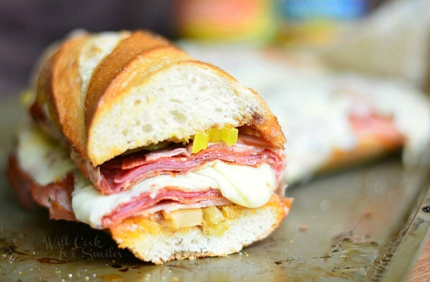 Spicy Italian Sub Sandwich. Made with all the great Italian flavors like capicola ham, smoked ham, salami, pepperoni, Fontina cheese, banana peppers and hot Italian Sandwich Mix. #sandwich #sub #italian #spicy #ham