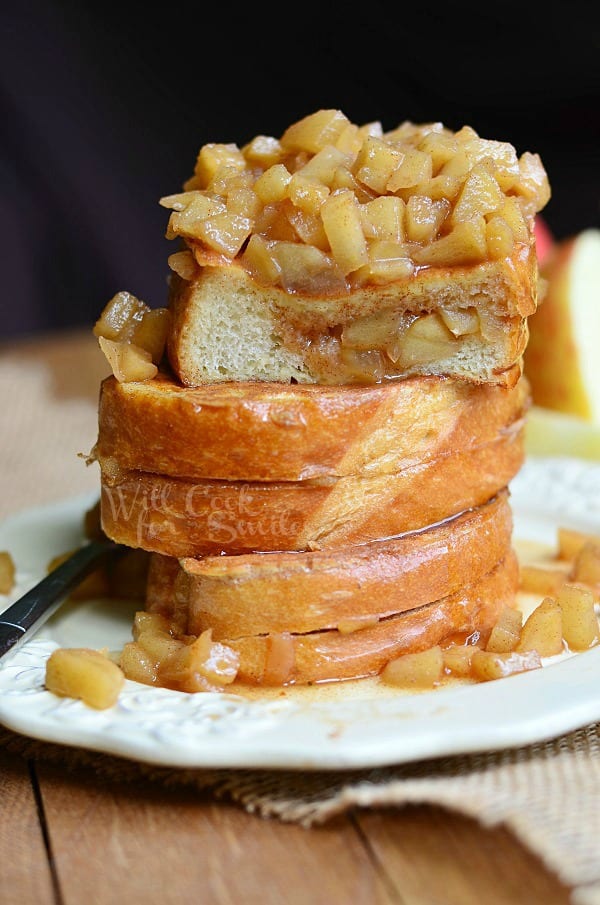 Apple Pie Stuffed French Toast stacked up on a plate with a fork 