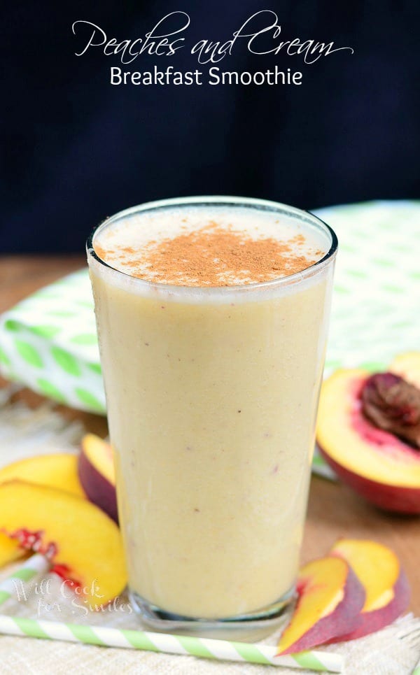 Peaches and Cream Breakfast in a clear glass with peaches around it 