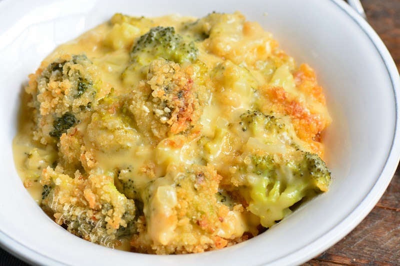 closeup of broccoli casserole in a white bowl.