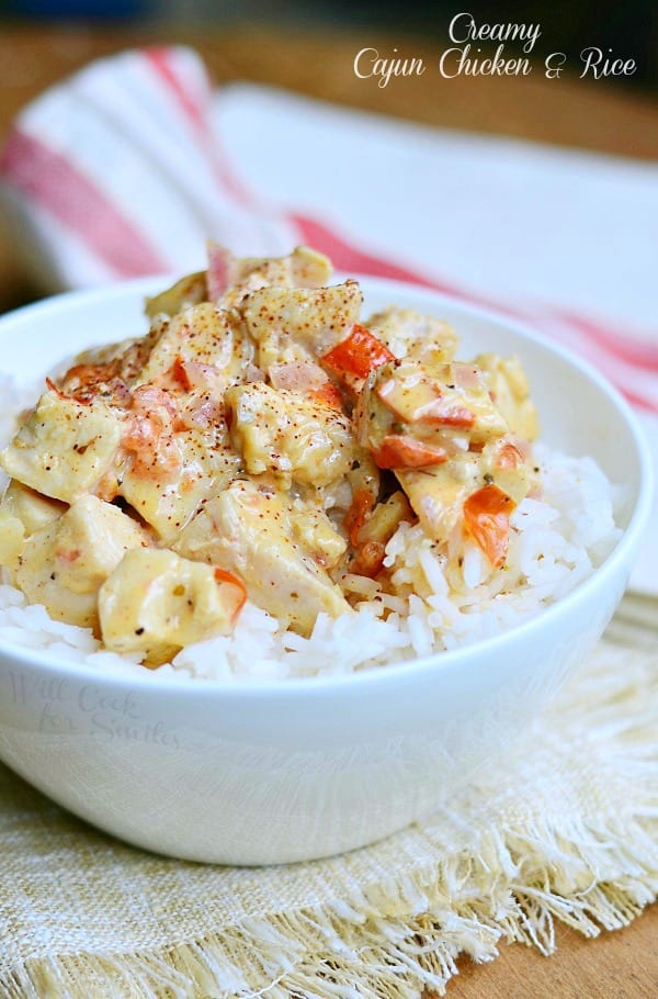 Creamy Cajun Chicken & Rice with diced red peppers in a white bowl 