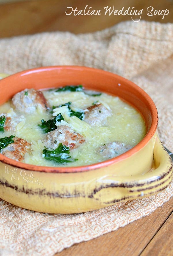 Italian Wedding Soup with Turkey Meatballs and Orzo in a yellow soup bowl 