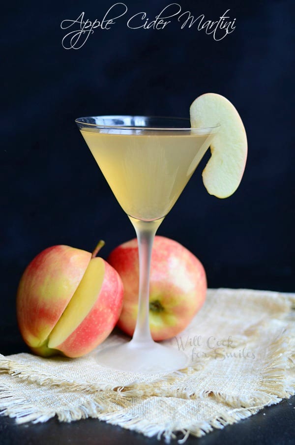 Apple Cider Martini in a martini glass with apples around it 