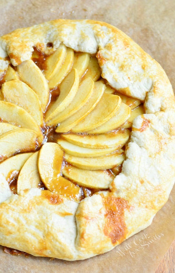 view fro above of caramel apple galette on wax paper on wooden table