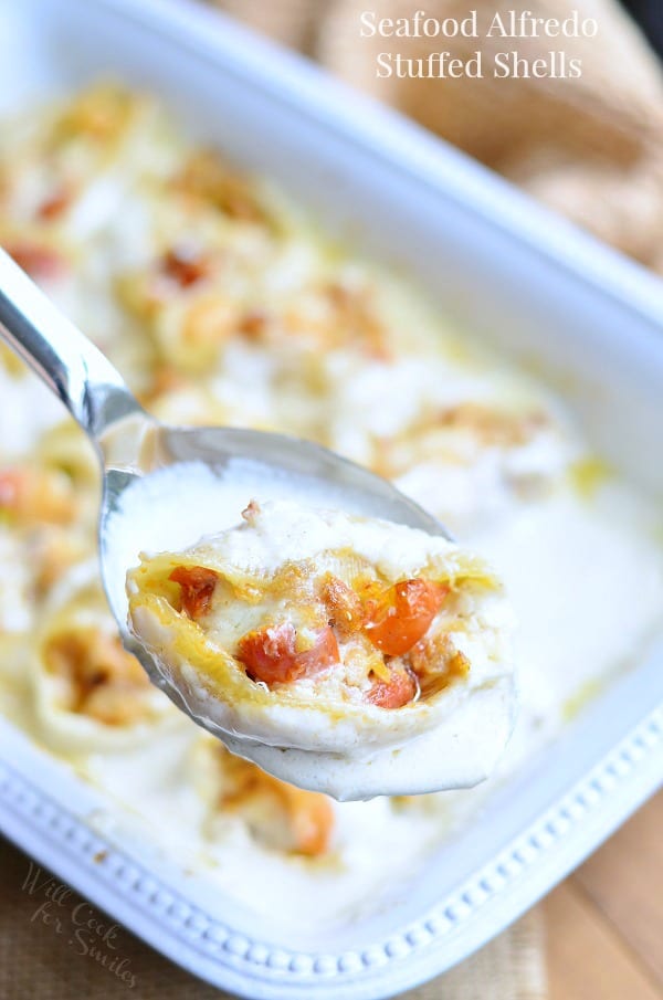 Seafood Alfredo Stuffed Shells on a spoon 