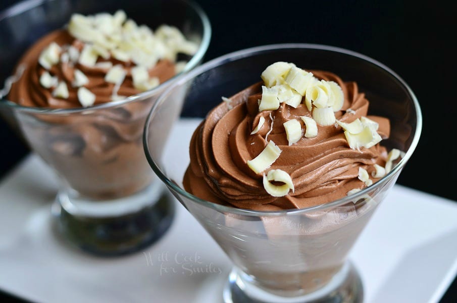 Chocolate Mousse Recipe in glasses with white chocolate shavings on a white plate 