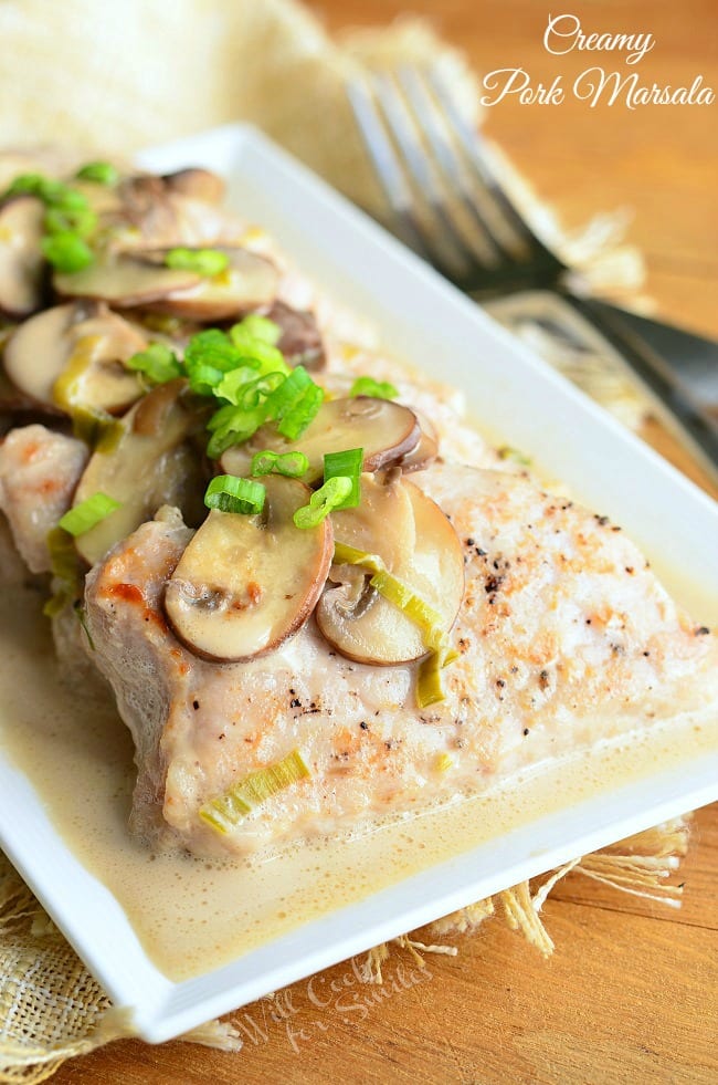 Creamy Pork Marsala is a delicious easy dinner, and it's ready in 30 minutes. Soft pork tenderloin seared and then cooked in creamy Marsala sauce with some mushrooms and green onions. | from willcookforsmiles.com
