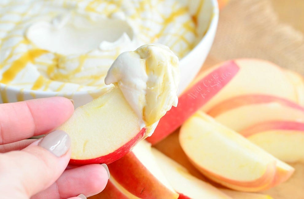 Caramel Cheesecake Fruit Dip. Light cream cheese, caramel creamer, fat free yogurt, and light caramel are all whipped to a delicate and smooth perfection making this dip out-of-this-world. #dip #dessert #fruitdip #creamcheese #caramel #skinny