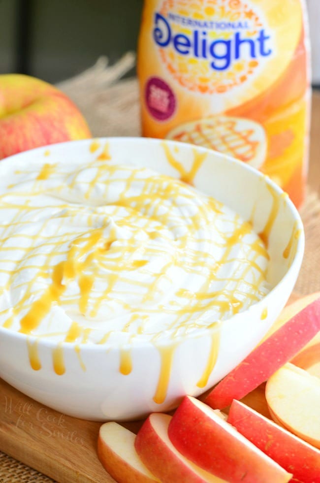 Caramel Cheesecake Fruit Dip. Light cream cheese, caramel creamer, fat free yogurt, and light caramel are all whipped to a delicate and smooth perfection making this dip out-of-this-world. #dip #dessert #fruitdip #creamcheese #caramel #skinny