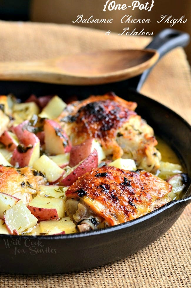 side view of cooked chicken and potatoes in the skillet