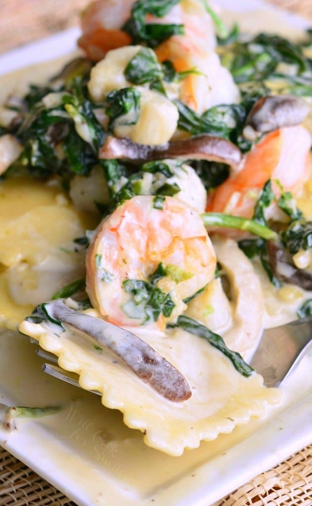 Ravioli with Seafood, Spinach and Mushrooms in Garlic Cream Sauce