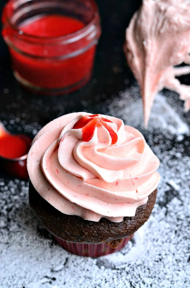 Strawberry Buttercream Frosting on a mixer whisk 