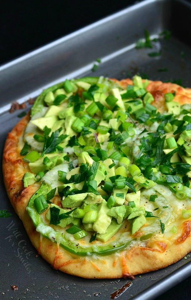 Green Naan Pizza with avocado, green peppers and green onions on top.  