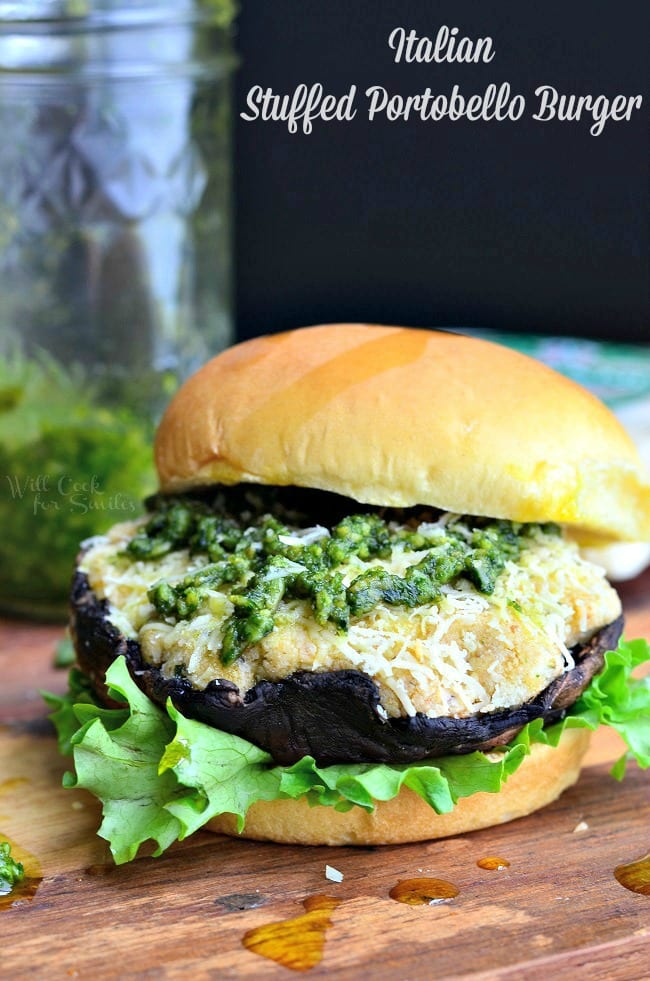 Italian Stuffed Portobello Burger on a bun with lettuce and pesto on top 