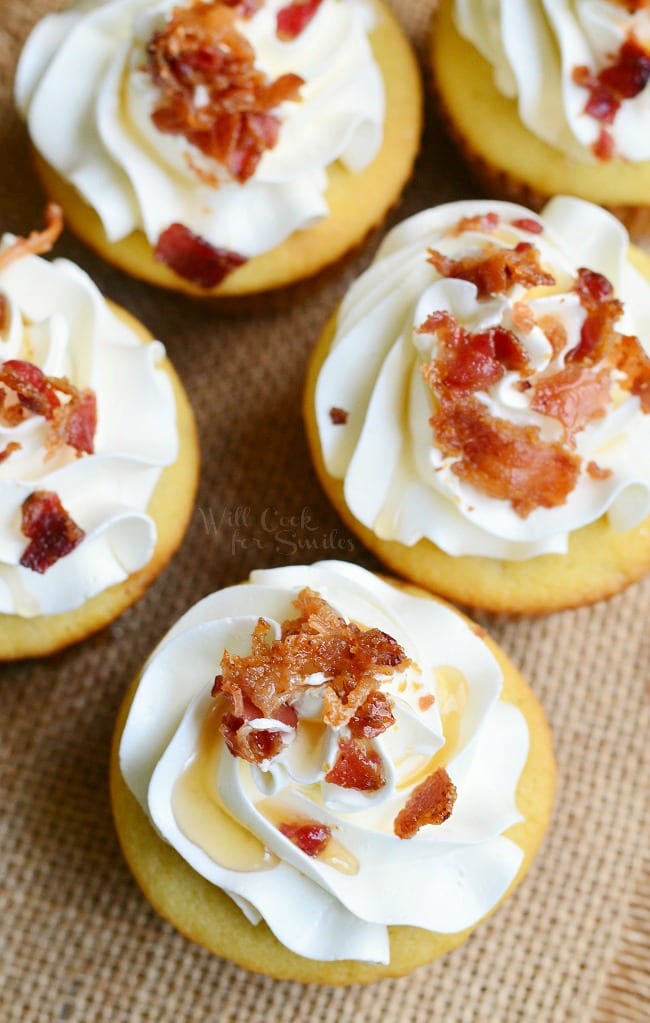 top view of Maple Bacon Cupcakes with frosting and bacon crumbles on top 