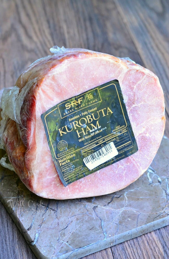 picture of packaged kurobuta ham on a stone cutting board