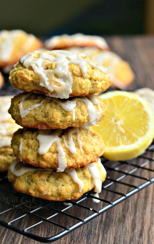 Oatmeal Cookies with a lemon glaze stacked up on a cooling rack 