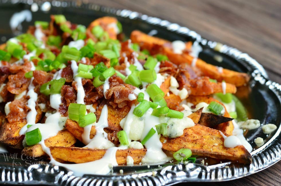 Silver platter filled with loaded sweet potato wedges