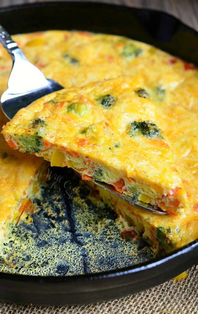 Vegetable and Cheese Breakfast Bake being lifted by pie spatula 
