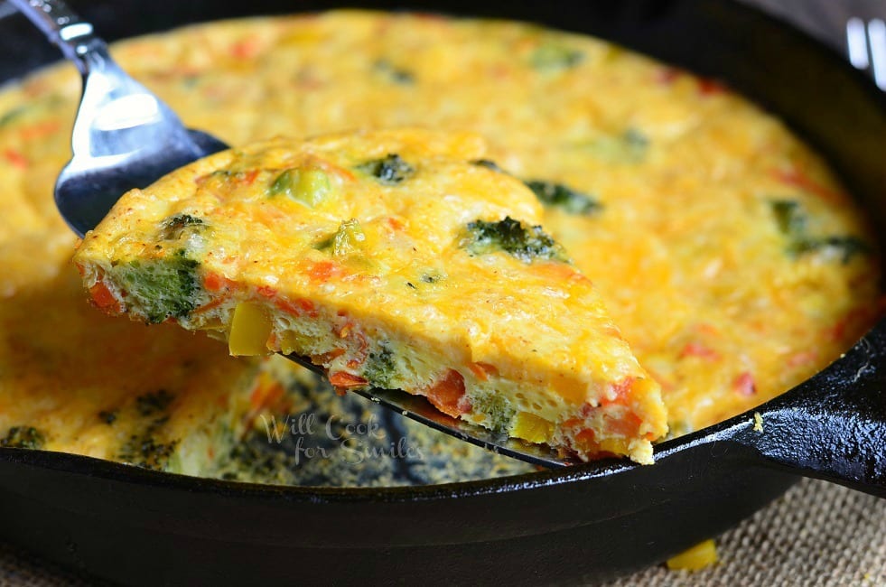 Vegetable and Cheese Breakfast Bake being lifted by pie spatula 