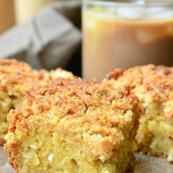 3 portions of coconut coffee cake on a stone table in front of a glass of iced coffee