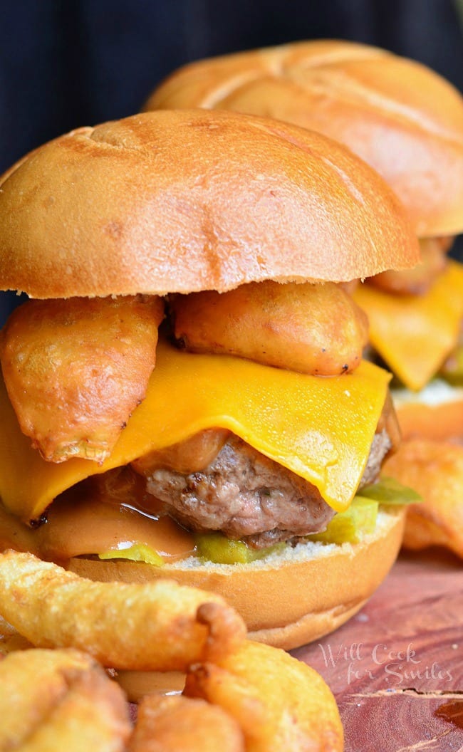 Onion Ring BBQ Cheeseburger. Fabulous juicy burger made with sharp cheddar cheese, mustard based bbq sauce, pickles and topped with delicious homemade onion wedges. | from willcookforsmiles.com