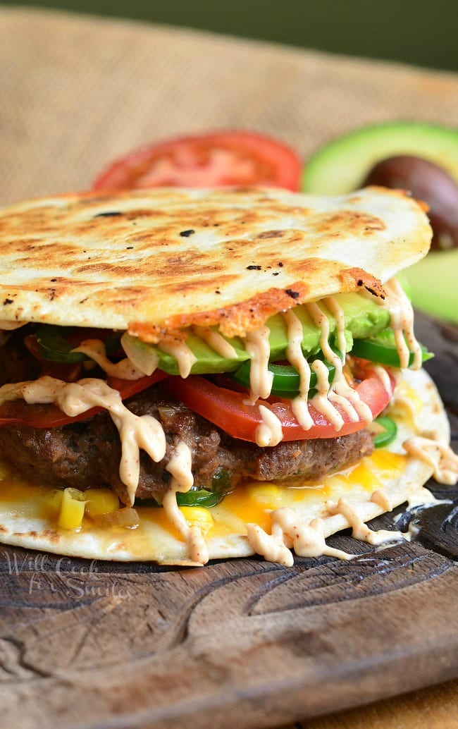 Quesadilla Burger with avocado tomato and fried tortilla as the bun 